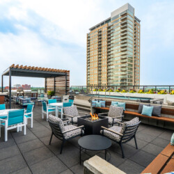 rooftop lounge with firepit and chairs
