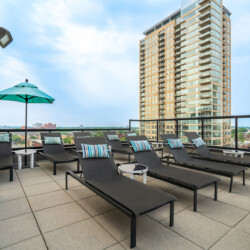 lounge chairs on the roof of an apartment building